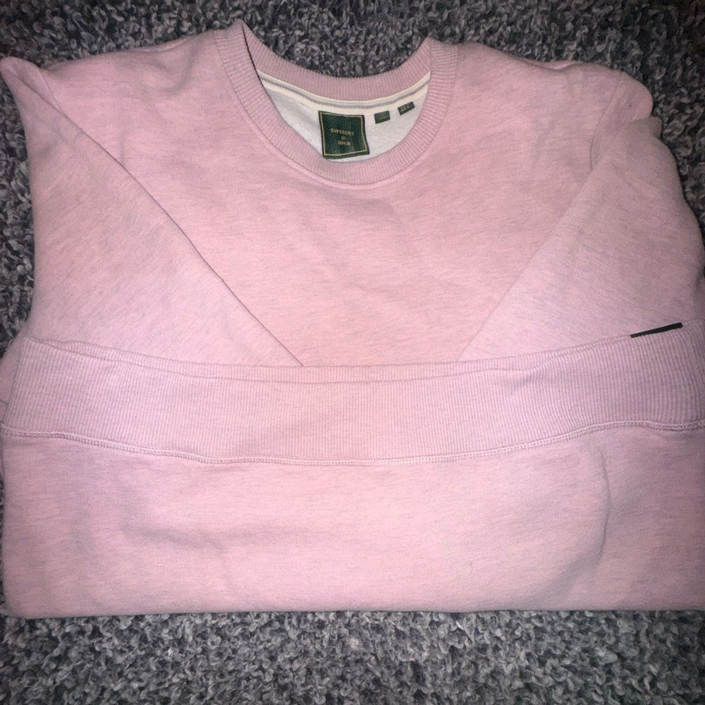This is a long sleeve light pink and cozy sweater suited for fall. Never worn